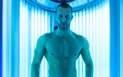 Young Muscular Man At Solarium In Beauty Salon